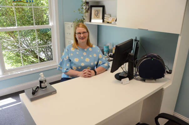 Heather White, Au.D., at a Bright Life Hearing Care, LLC desk